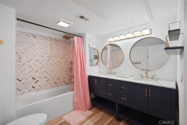 full bathroom featuring shower / bath combination with curtain, vanity, toilet, and hardwood / wood-style floors