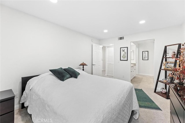 bedroom with light colored carpet