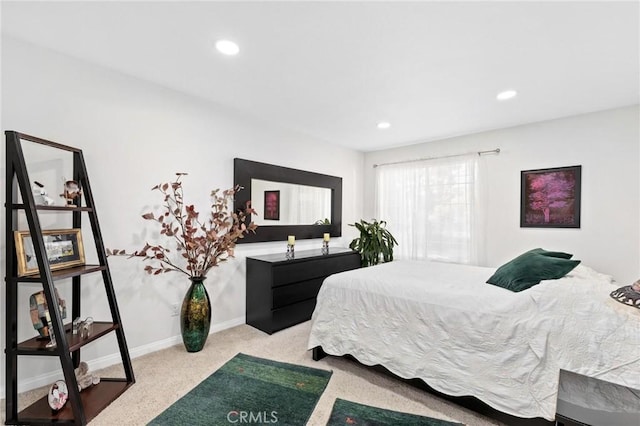 bedroom with light colored carpet