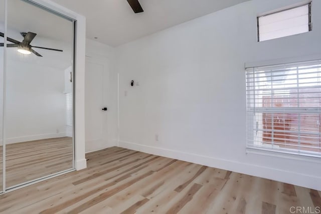 spare room with ceiling fan and light hardwood / wood-style floors