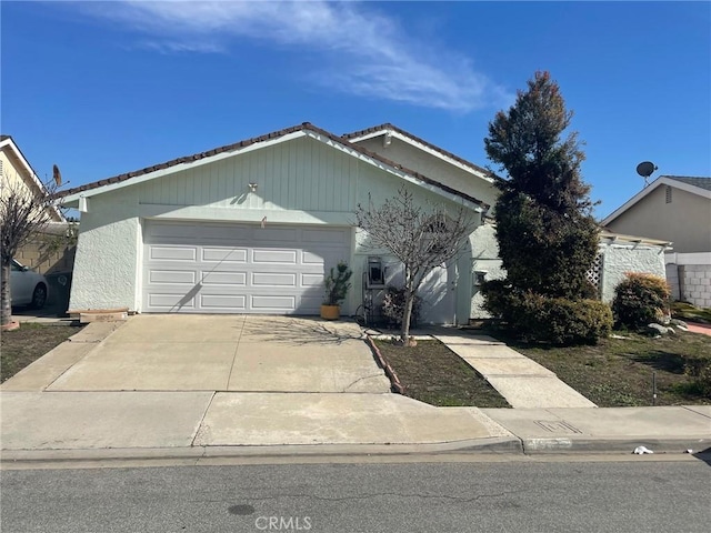 3362 Fuchsia St, Costa Mesa, CA 92626 - ranch-style house with a garage, driveway, and stucco siding