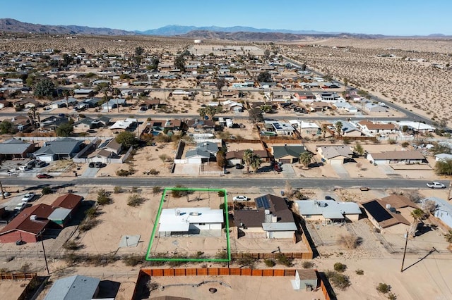 birds eye view of property featuring a mountain view