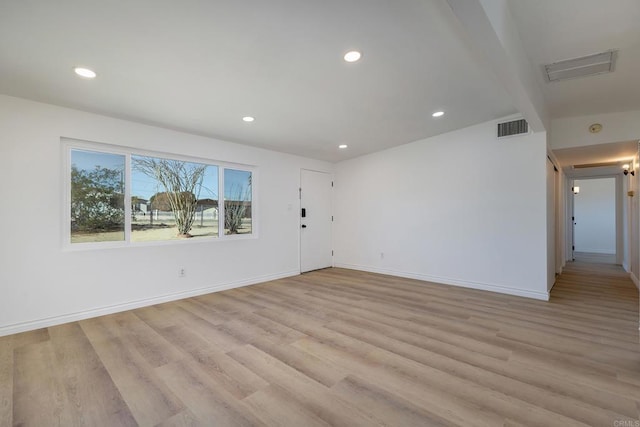 spare room with light hardwood / wood-style flooring