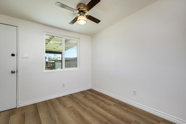 spare room featuring ceiling fan and wood-type flooring