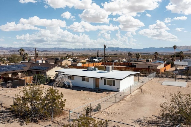 birds eye view of property featuring a mountain view