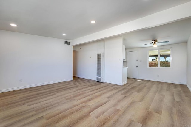 unfurnished living room featuring light wood-type flooring and ceiling fan