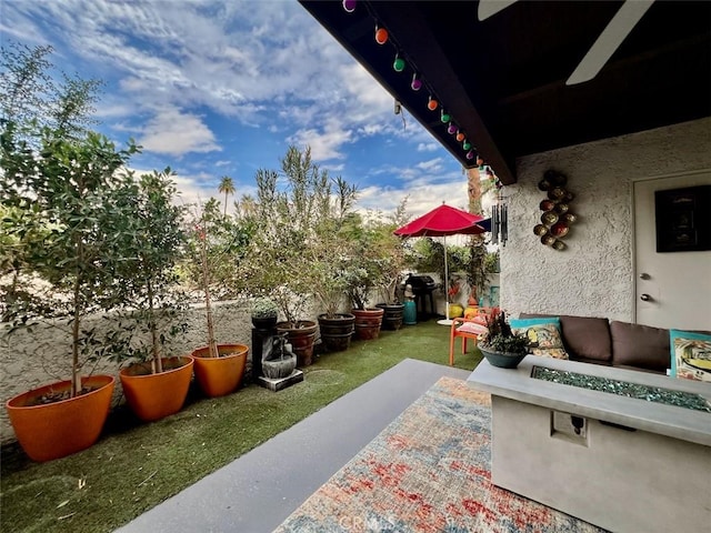 2230 S Palm Canyon Dr Unit 7, Palm Springs, CA 92264 - view of patio with a fire pit