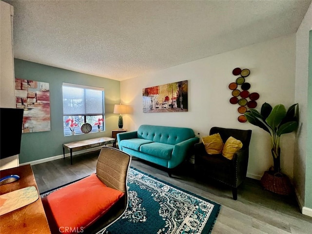 2230 S Palm Canyon Dr Unit 7, Palm Springs, CA 92264 - living room with wood finished floors and a textured ceiling
