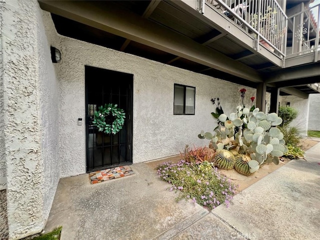 property entrance with a balcony