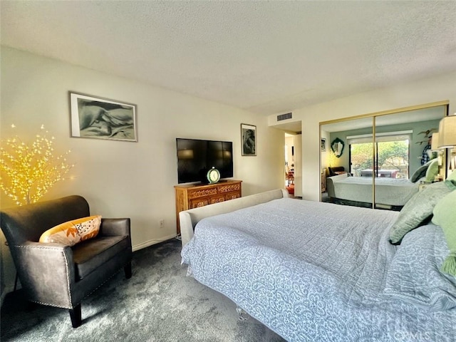 2230 S Palm Canyon Dr Unit 7, Palm Springs, CA 92264 - carpeted bedroom with a textured ceiling and a closet