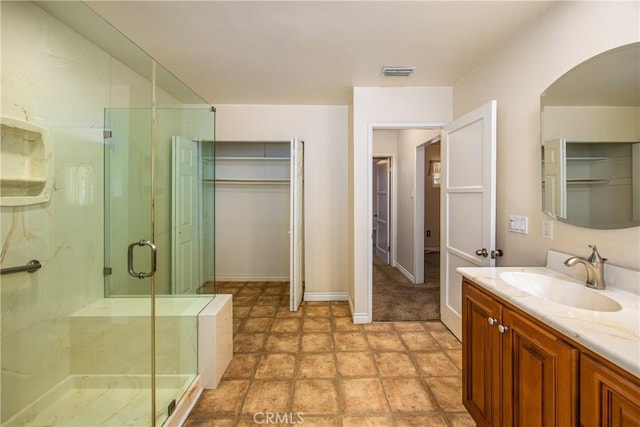 bathroom with vanity and walk in shower