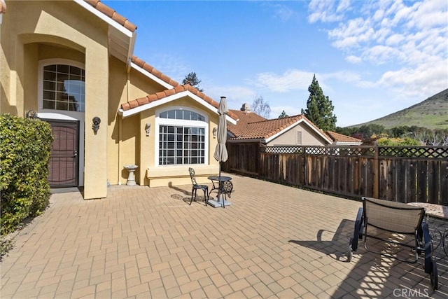 view of patio / terrace with a mountain view