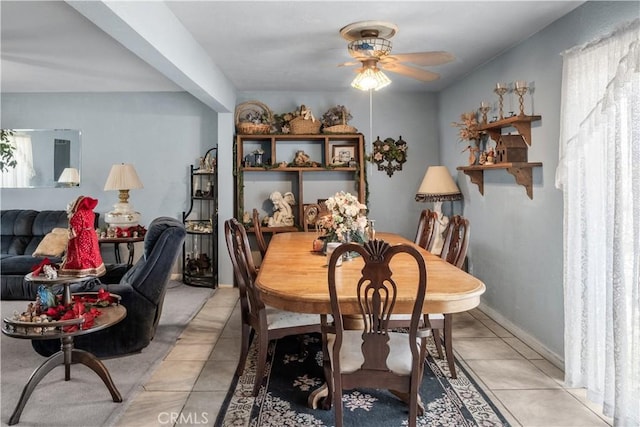 dining room with ceiling fan and light tile patterned floors