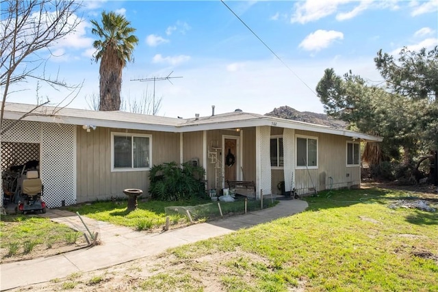 ranch-style house with a front yard