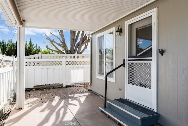 view of patio / terrace featuring entry steps and fence