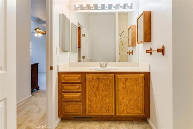 bathroom featuring a ceiling fan, visible vents, and vanity