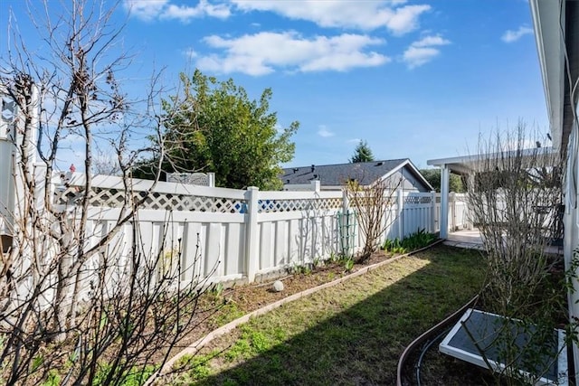 view of yard with a fenced backyard