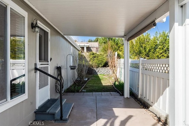 view of patio / terrace with entry steps and fence