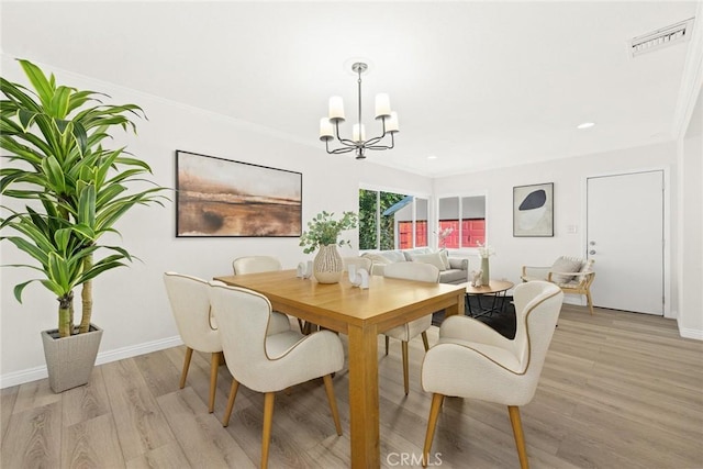 dining space with visible vents, baseboards, light wood-style flooring, a chandelier, and recessed lighting