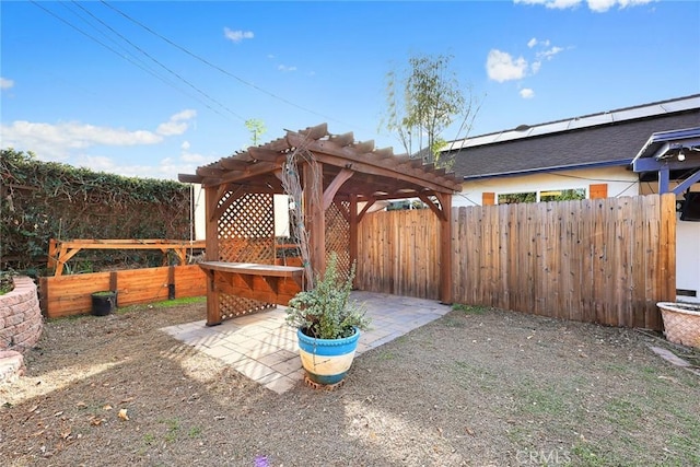 view of patio / terrace with fence and a pergola