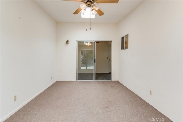 empty room featuring carpet and ceiling fan