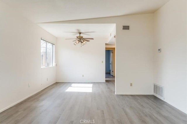 empty room with light wood-type flooring and ceiling fan