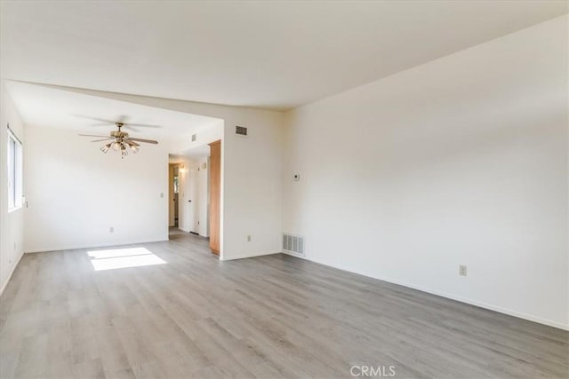 unfurnished room with light hardwood / wood-style flooring and ceiling fan