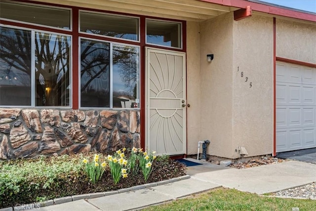 entrance to property featuring a garage