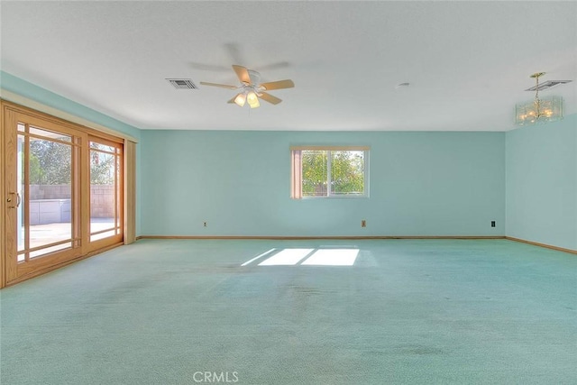 carpeted empty room with ceiling fan