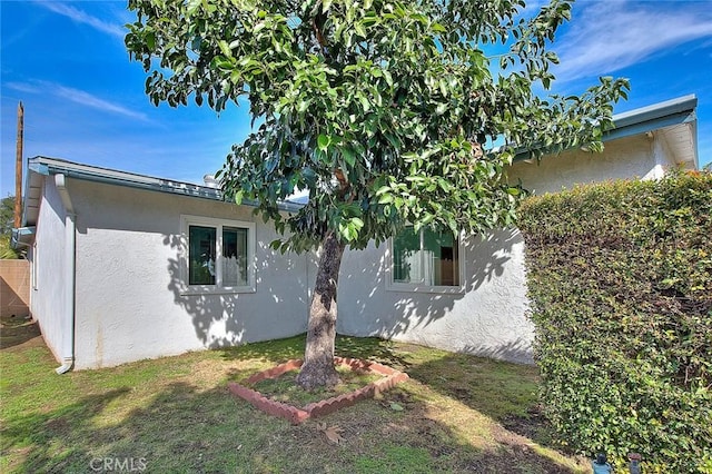 view of home's exterior featuring a lawn