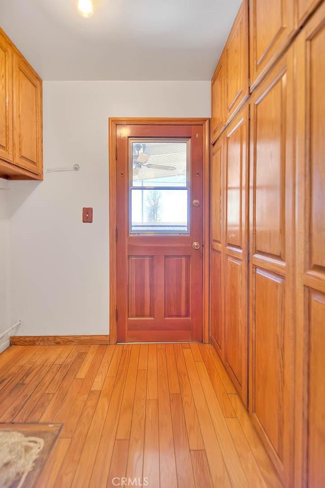 doorway with light wood-type flooring