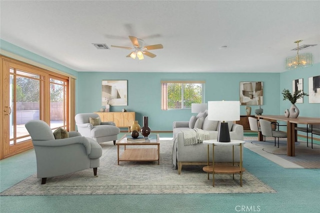 living room with light carpet and ceiling fan