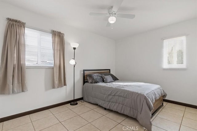 tiled bedroom with ceiling fan