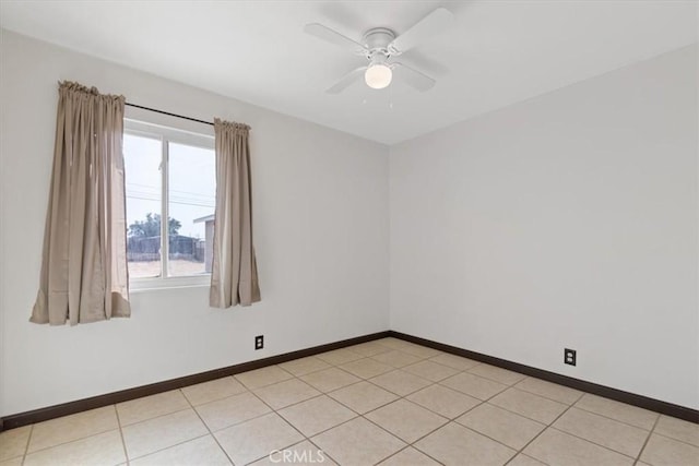 unfurnished room with light tile patterned flooring and ceiling fan