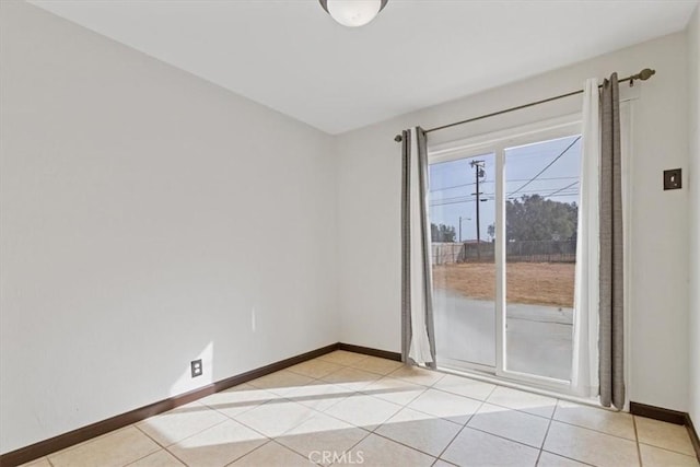 empty room featuring light tile patterned floors