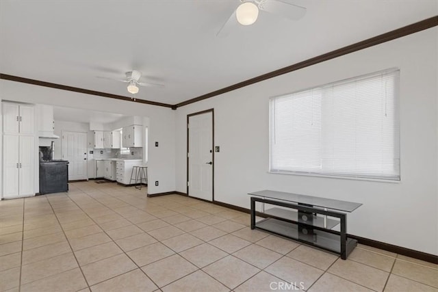 unfurnished living room with ornamental molding, ceiling fan, and light tile patterned floors