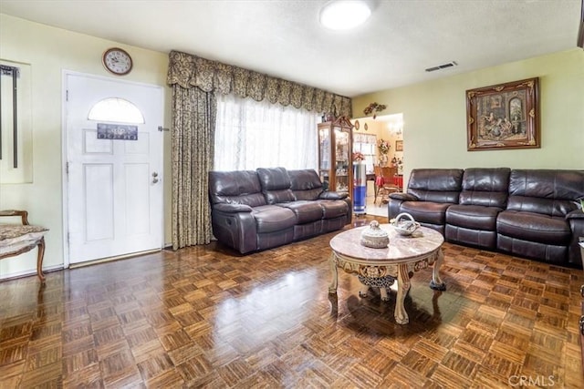 living room with dark parquet floors