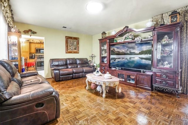 living room with parquet flooring