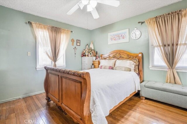 426 Sonora Ave, Glendale, CA 91201 - bedroom featuring multiple windows, hardwood / wood-style flooring, ceiling fan, and a textured ceiling
