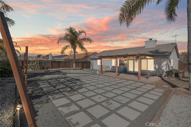 view of patio terrace at dusk