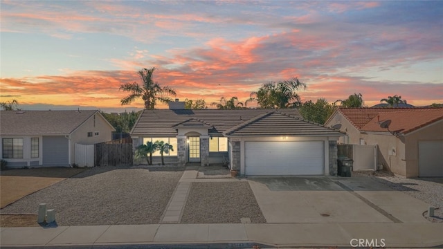 ranch-style home featuring a garage