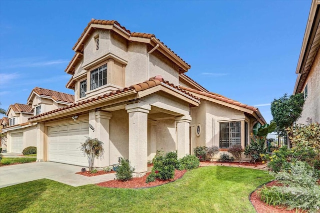 mediterranean / spanish house with a front yard and a garage