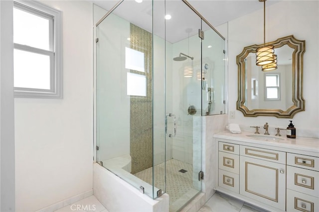 bathroom featuring separate shower and tub and vanity