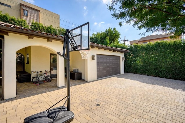 view of patio with a garage