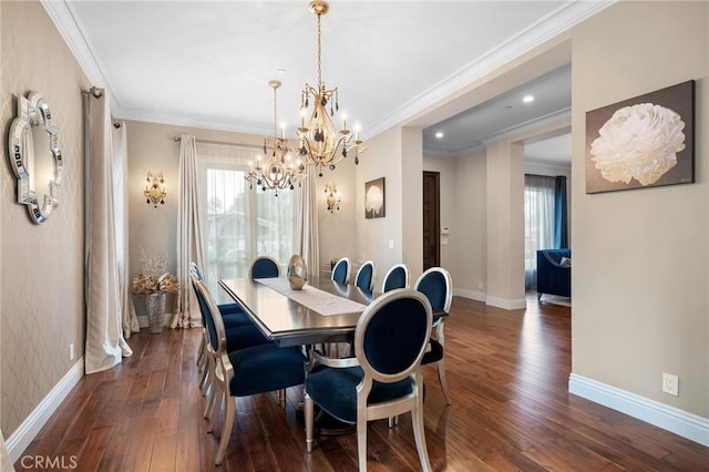 dining room featuring dark hardwood / wood-style flooring, crown molding, and a notable chandelier