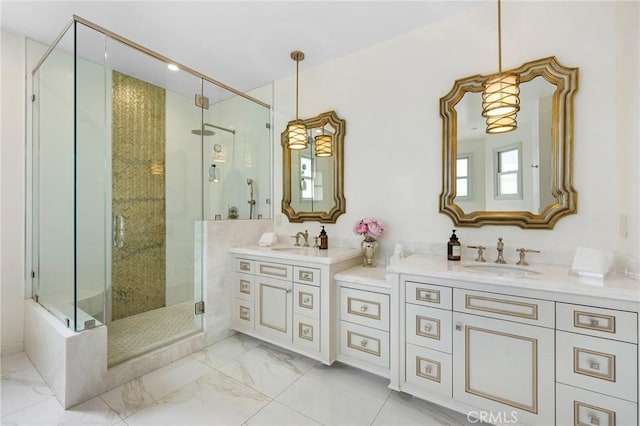 bathroom featuring an enclosed shower and vanity