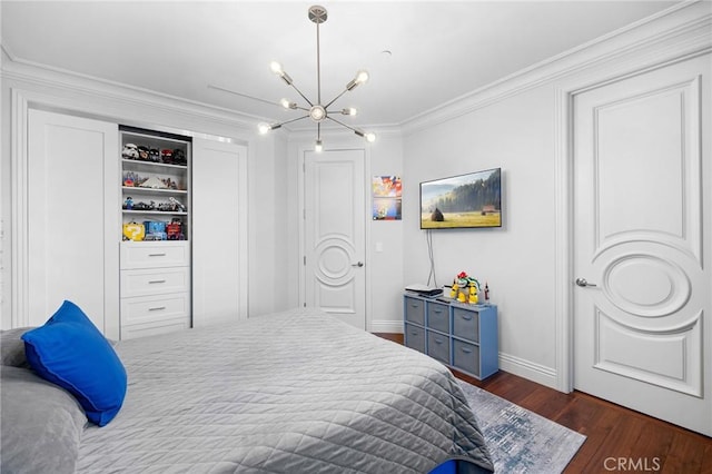 bedroom with crown molding, a chandelier, and dark wood-type flooring