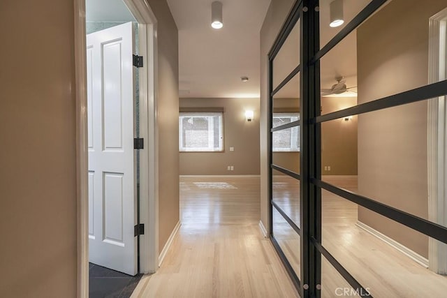 hallway featuring light wood-type flooring