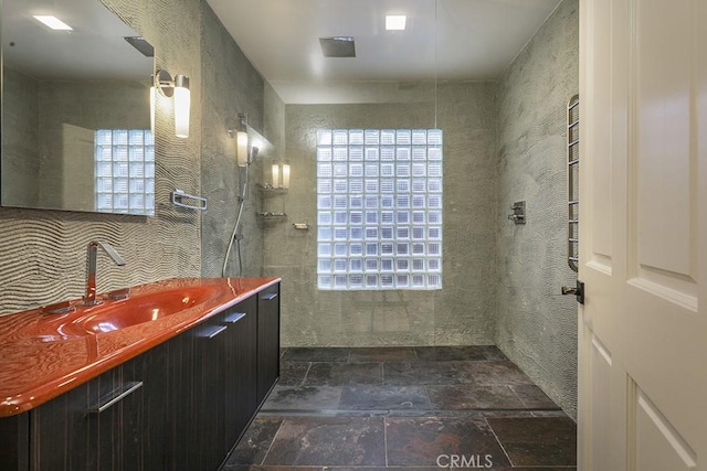 bathroom with vanity and walk in shower