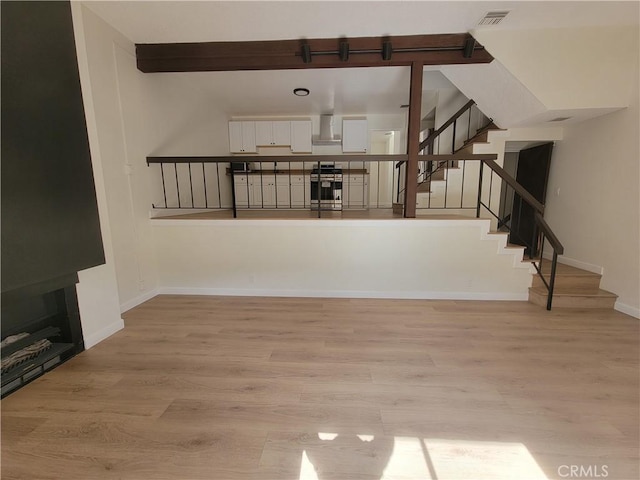 unfurnished living room featuring light hardwood / wood-style flooring